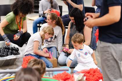 Kids playing with materials in gallery