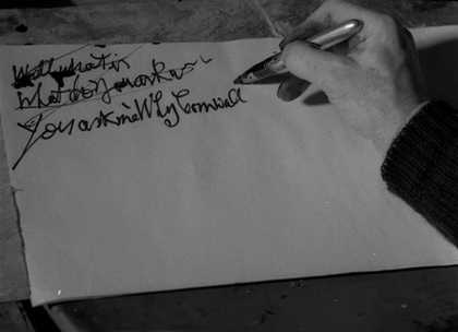 Film still of W.S Graham Why Cornwall showing a hand writing a letter